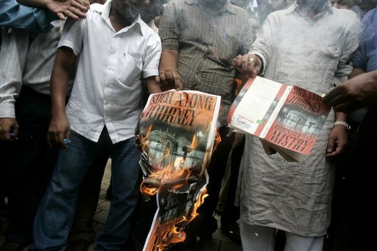 Activists of the Bharatiya Vidyarthi Sena and the Shiv Sena, a Mumbai-centered political party known for regional chauvinism and Hindu fundamentalism, burn copies of Rohinton Mistry's acclaimed 1991 novel 'Such a Long Journey' during a protest in Mumbai, India, on Sept. 14. In a battle for the cultural soul of Mumbai brewing between Hindu radicals and the cosmopolitan urbanites, the radicals appear to be winning. 